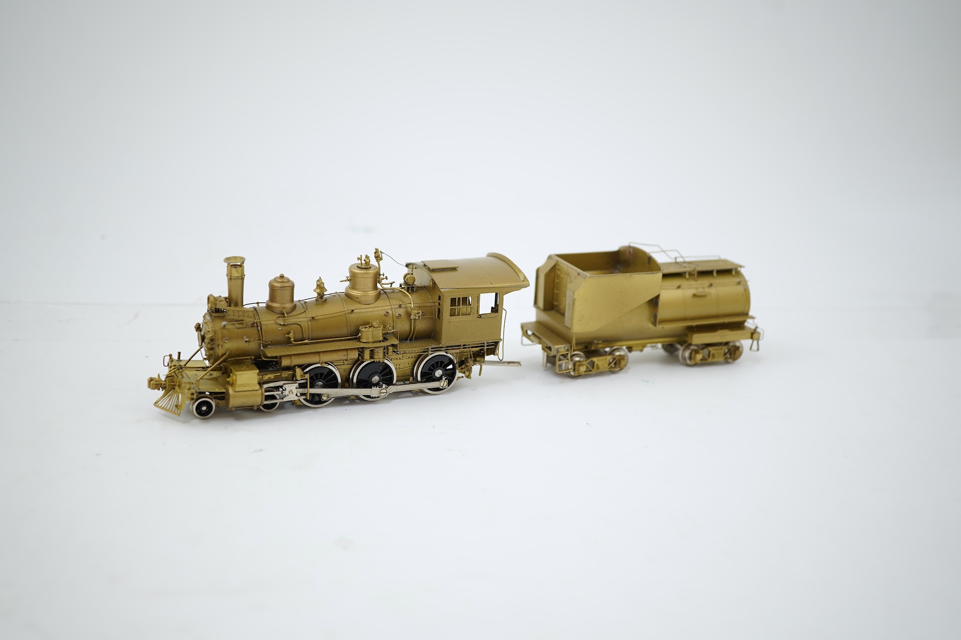 A boxed HO gauge Sunset Models unpainted brass model of Union Pacific 1242 4-6-0 locomotive with bogie tender, powered for two rail operation.